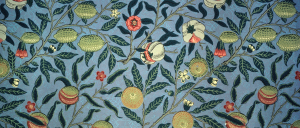 Wallpaper designed by William Morris in 1862. The pattern features pomegranates, oranges and lemons surrounded by leaves and flowers against a blue background.