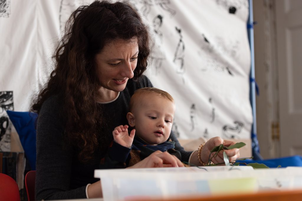 Mother and baby participating in a craft workshop at William Morris Gallery