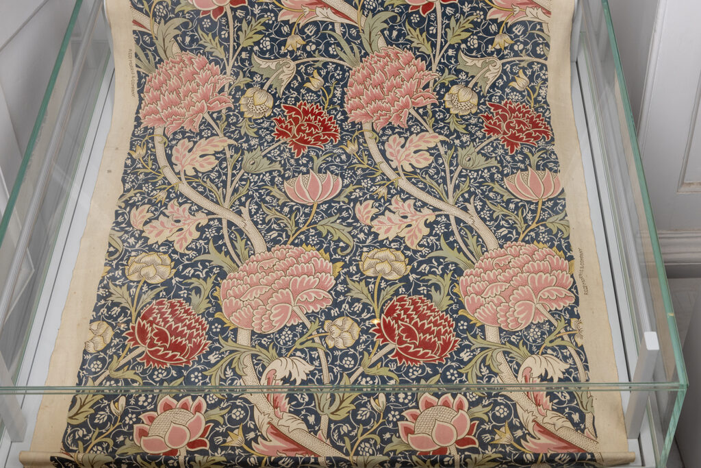Example of a William Morris 'Bourne' design printed on cotton and displayed in a cabinet
