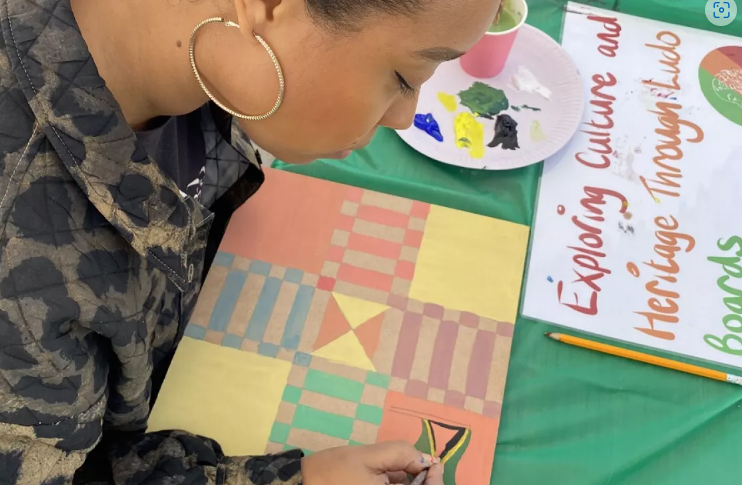 Woman painting a ludo board