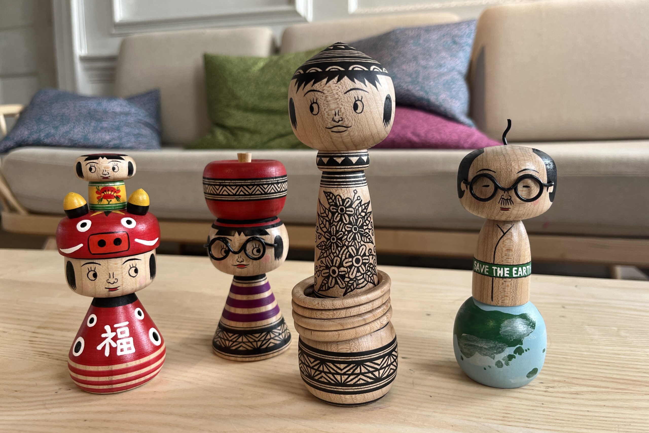 A group of carved wooden kokeshi dolls from Japan