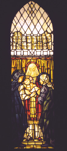 Stained glass panel of a High Priest holding Jesus, with Mary and another woman