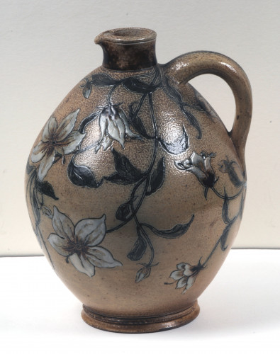 Jug is etched in a decorative floral pattern