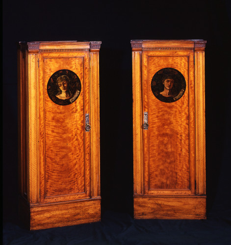 wooden cabinet with painted portrait on door