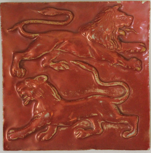 Red lustre tile with two lions