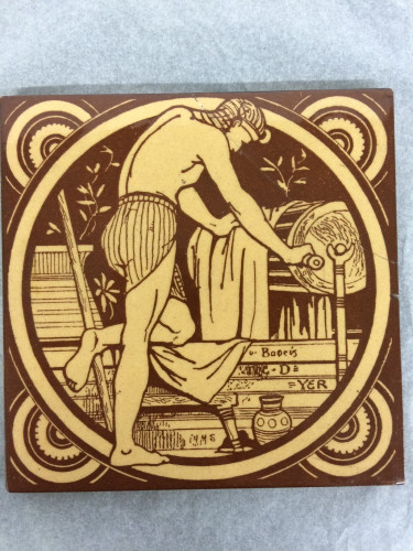 yellow and brown tile showing dyer standing over vat