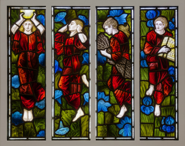 stained glass panel with four female figures