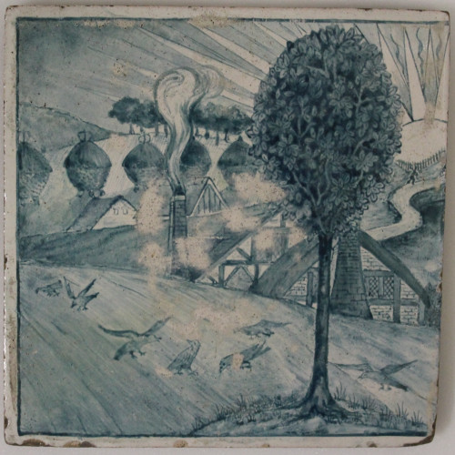 Blue and white tile depicting hills, buildings and animals