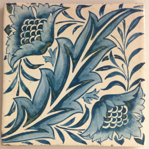 tile, hand painted with design of a leaf with two flowers