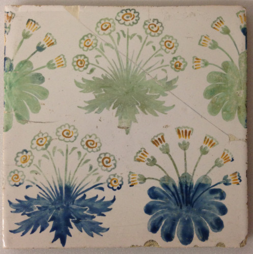tile, hand painted with clumps of daisies