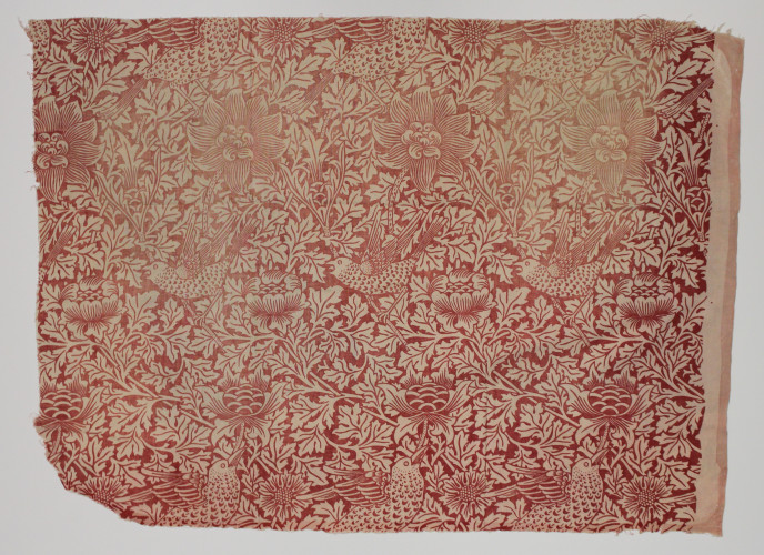 Square of fabric featuring a floral design in red with rows of birds.