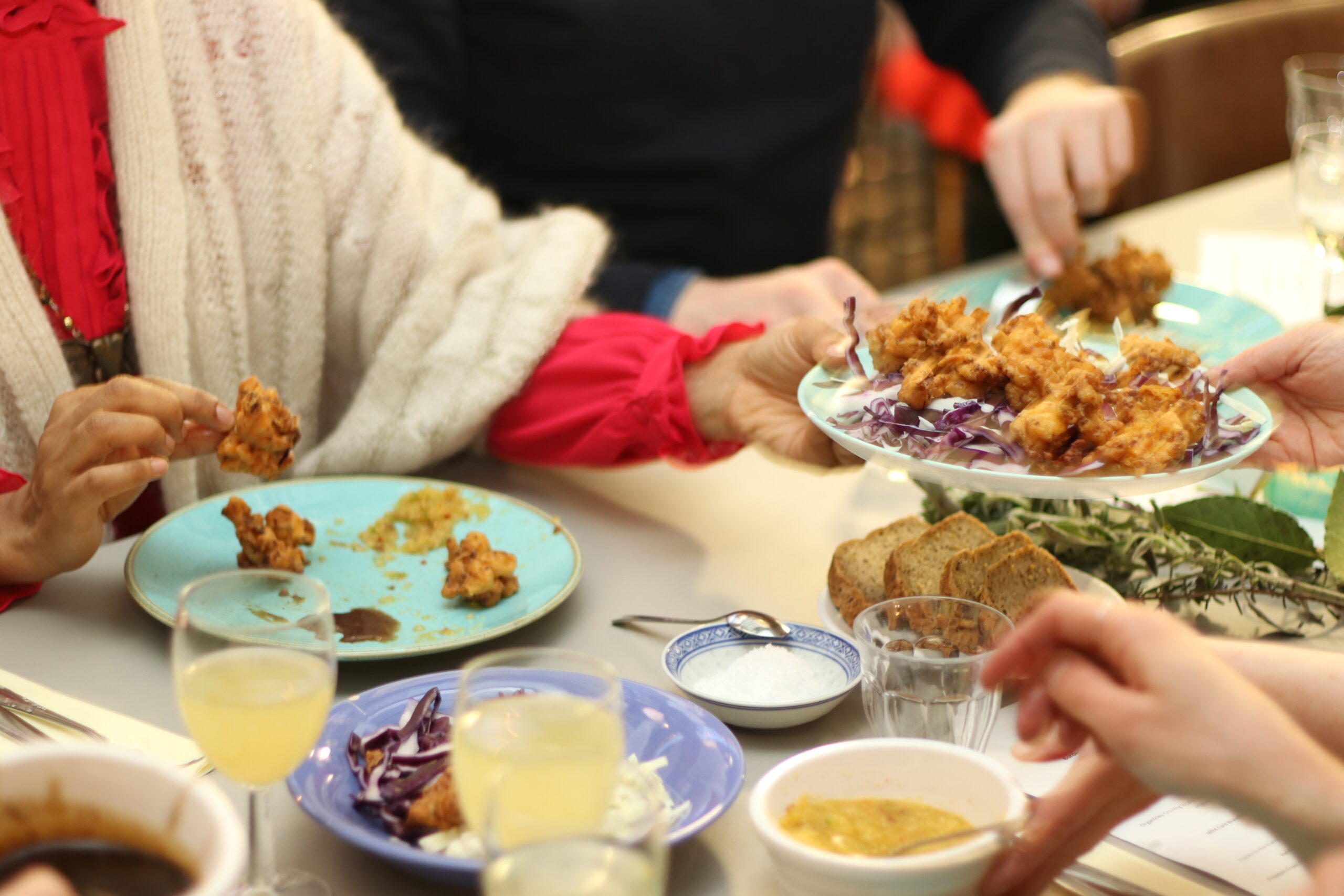People sharing food at a table