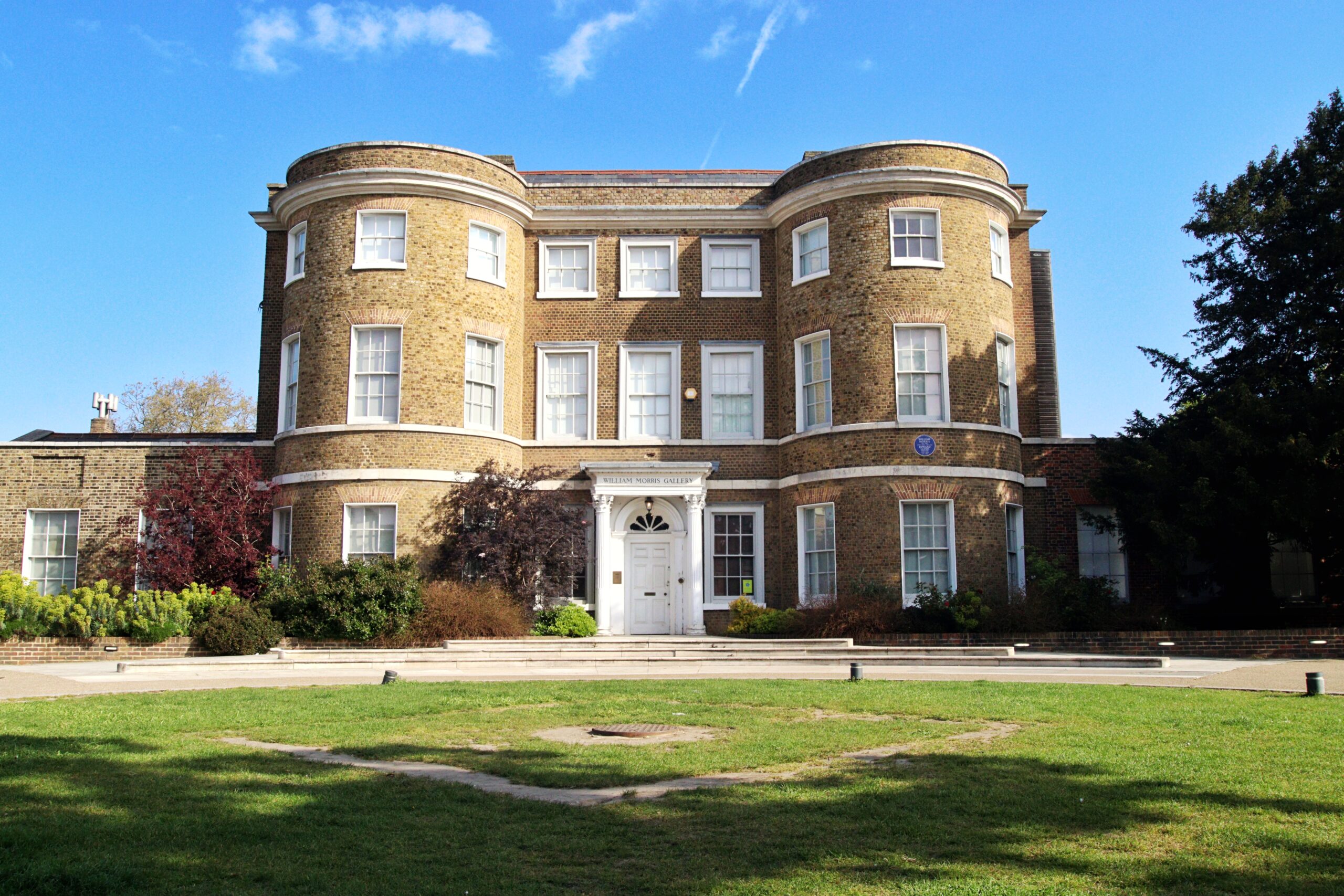 Exterior of the front of William Morris in the sunshine