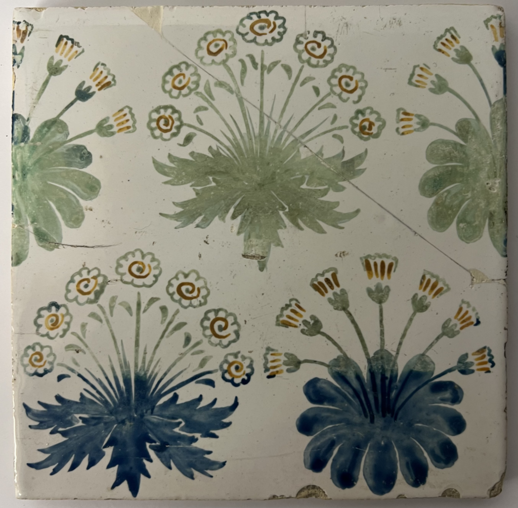 tile, hand painted with clumps of daisies